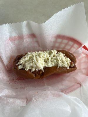 Hotdog with sauce, slaw, onions