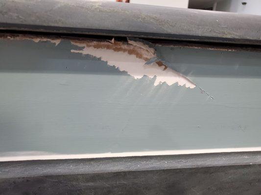 Didn't bother to score the paint before they ripped off the old countertops.