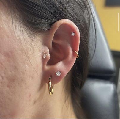 Lobe, tragus, and helix with implant grade titanium push pins. Lobe and helix have standard jewelry that come with the cost of our piercings
