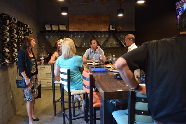 Members enjoying our beautiful tasting room, appointed with varietal specific Riedel glassware.