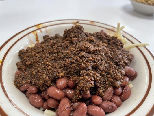 The chili, artfully arranged with a few Jackson Pollock-style flourishes.