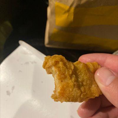 C'mon I know it's McDonald's, but can I get my nuggets without a bite in it please?!!