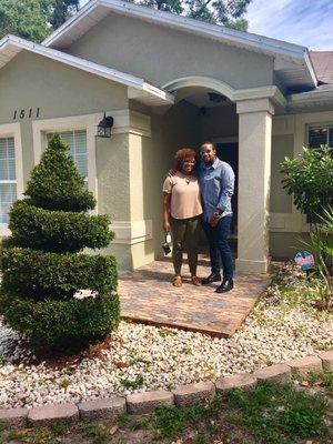 Pictured in front of my home with my brother.