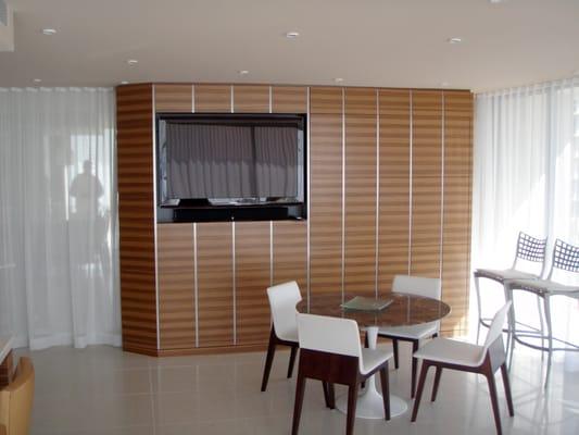 Living Room entertainment cabinet with queen size fold down bed.