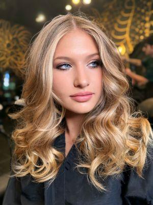 Beautiful balayage and highlights were used to achieve this stunning color.