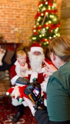 Photographer/owner taking Santa photo