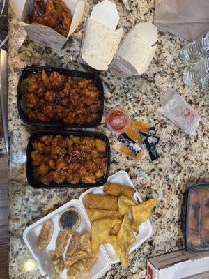 Hot n spicy wontons, rice, orange chicken, crispy sesame chicken, pan fried dumplings, cheese wontons, vegetable egg roll