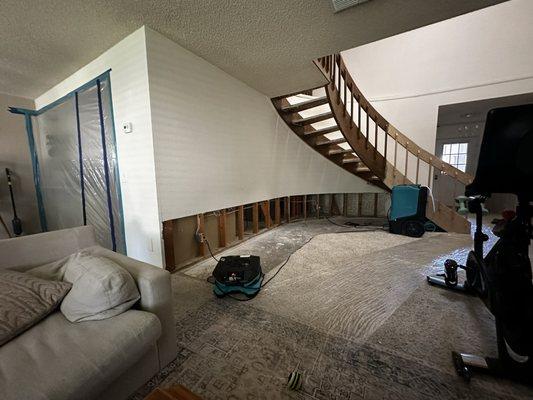 *Before pic* Removed dry wall and carpet to dry framing/flooring from a water leak.