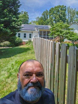 Homeowner and house with 18.9 kW solar system on roof