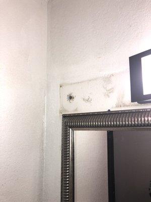 not sure if this was a larger mirror before or was another light but it looks bad.