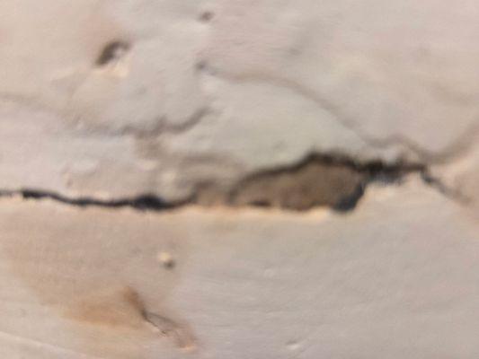 Caved in ceiling from old pipes leaking in the walls