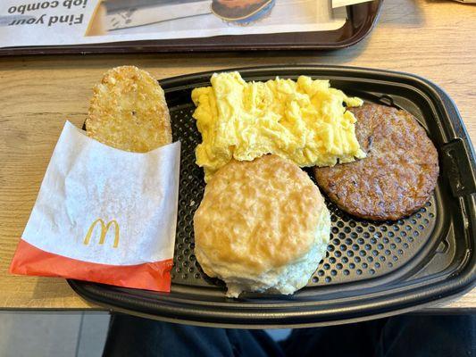 Breakfast with sausage and Biscuit. What's missing? CUTLERY!