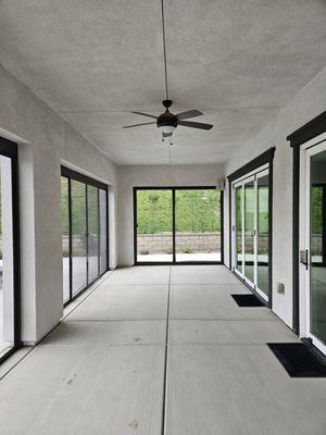 Patio transformed adding in a screened in living space.
