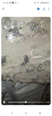 The left top of the corset where you could obviously see there's a hole and it's appears as if it was burnt done exclusively by Roxanna