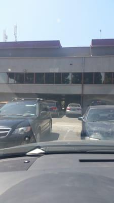 Park in the backside...go through the door up the elevator to floor 2. She's across the bathroom :)