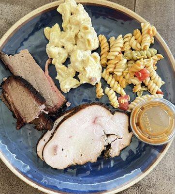 Got a picture before devouring this feast. Brisket, macaroni & cheese, pasta salad, tangy bbq sauce; and turkey(plated at home).