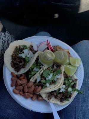 Carne asada tacos with beans on the side