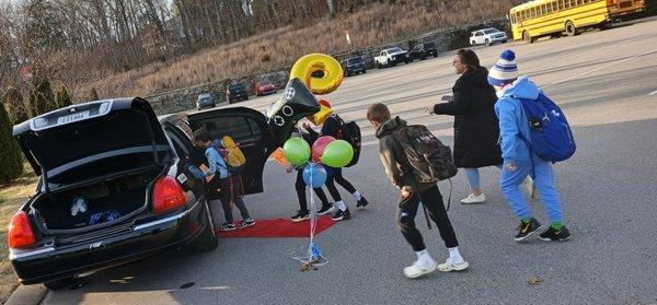 birthday boys in school carline in a Limo