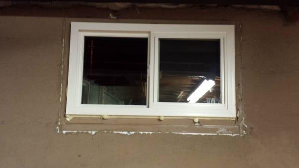 Before trimming. Foam around window, caulk along casing. Slider.