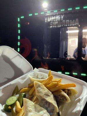 Sham in the back and my tasty chicken shwarma plate