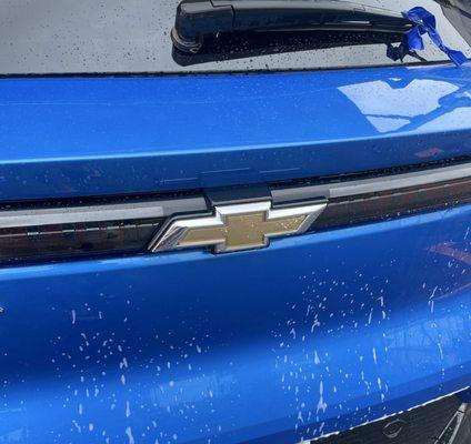 Soap on back of car after wash.