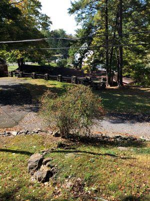 Cabins and lodge in front of the pool.