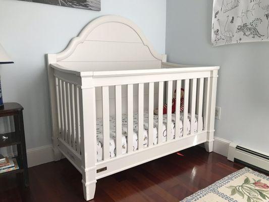 Convertible crib set up and ready to go in our nursery.