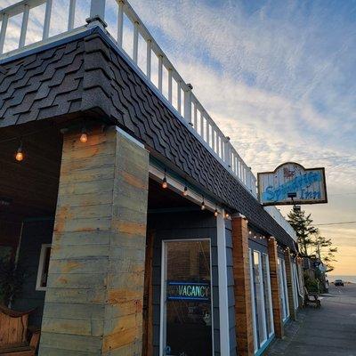 Lobby Laneda Ave.
Driftwood art makes our front door, people browse the events in the window ... and come in to book their room.