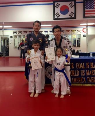 Tristan and Trisha's belt promotion with the most awesome Grandmaster Roh and master Ryan.