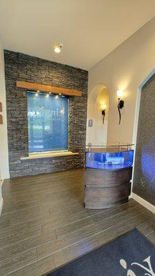 Inside area. There are no attendants but there is a small bench to sit on.