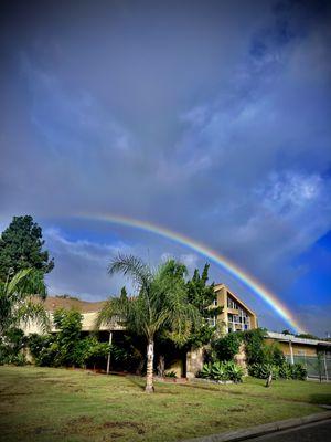 Front view of Preschool with beautiful rainbow