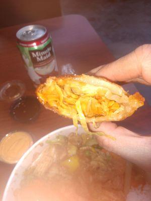 Biting into a vegetable egg roll