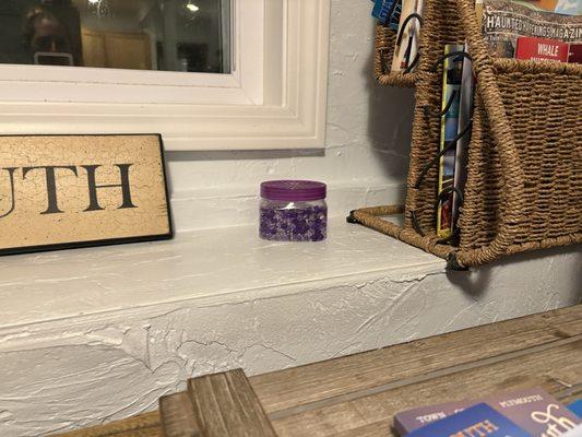 This is showing one of an obscene amount of air fresheners all throughout basement to hide the smell