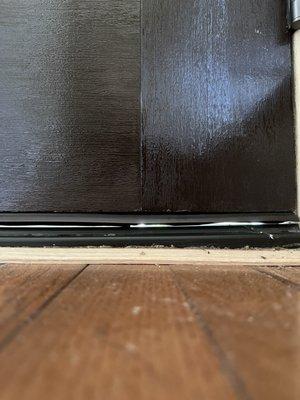 gap between the sweep and the floor. this was later fixed after a second contractor intervened.