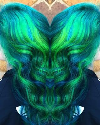Client wanted reverse ombré/balayage so I did a Tiffany blue root faded into a deep ocean blue with neon green peekaboos!