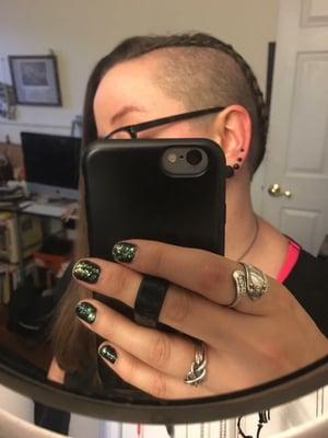 Undercut on both sides with cornrow along the sides.