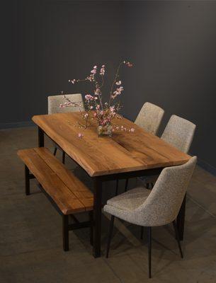 George Walnut Dining Table with Live Edge, Bench, Pascal Chairs.
