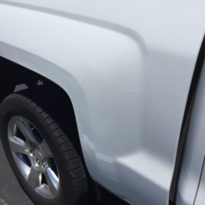 This was the after effects! The reflections are from the stripes on the parking lot, they are not dents or scratches....