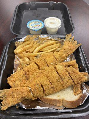 Fried whole catfish and golden French fries