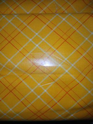 Do you carry this fabric? It's a Keepsake Calico Gold Plaid cotton fabric. It was at Joann Fabrics.
