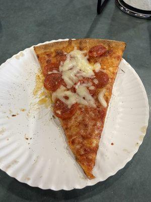 Single slice of pepperoni pizza