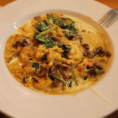 Delicia Cancun: steak, chicken, and shrimp with spinach, Pico de gallo, and a cream sauce