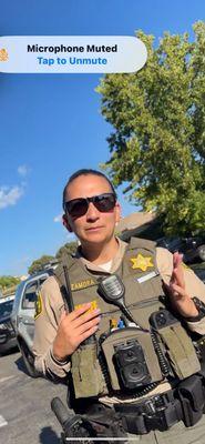 she moved her hands in this sense and I can see her name, but I can't see her badge number