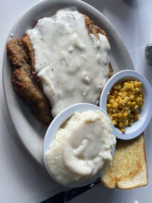 Country fried steak, mashed potatoes with corn