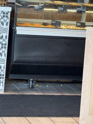 Look at this gross floor under their front display case!!