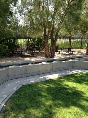 Picnic benches and lots of grass.