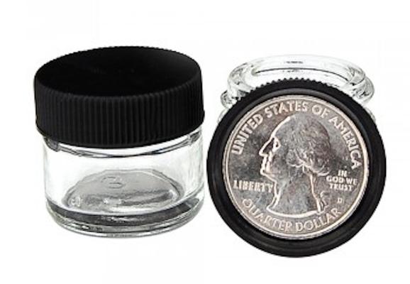 Our standard glass DabJar,with a US quarter inside the cap for size reference.