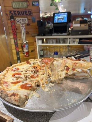 Pizza with mushrooms, onions and pepperoni