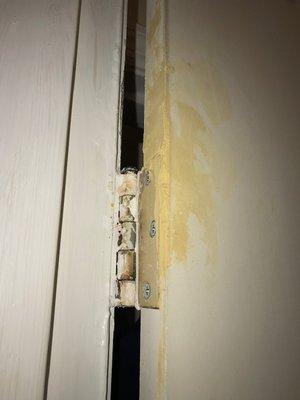 Door hinge that he cut to high. So he spackles filler onto the door.