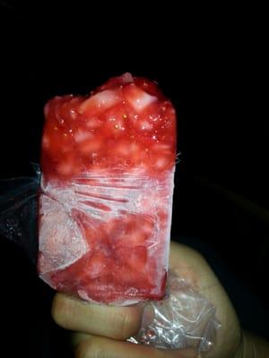 A water based strawberry popsicle